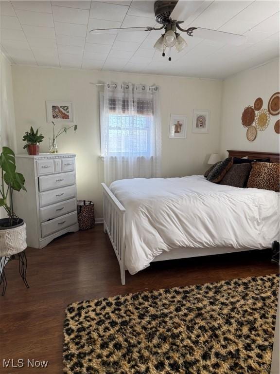 bedroom featuring ceiling fan and wood finished floors