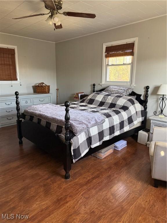 bedroom featuring ceiling fan and wood finished floors