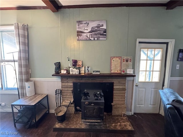 living room featuring dark wood-type flooring and beam ceiling