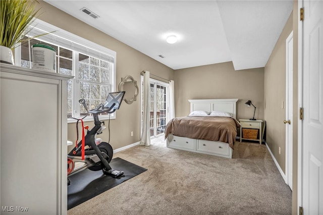 bedroom featuring access to outside, carpet, visible vents, and baseboards