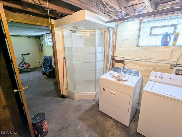 basement featuring washing machine and clothes dryer