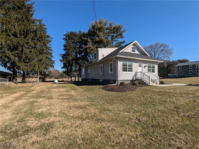 view of home's exterior with a yard