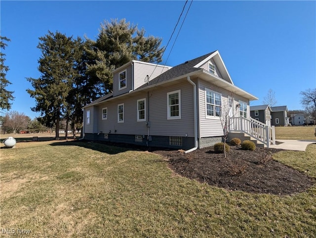 view of property exterior with a yard