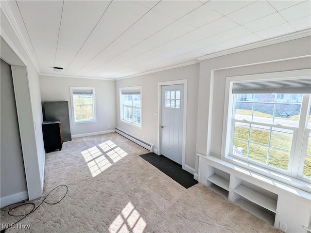 entrance foyer with baseboards, carpet floors, baseboard heating, and ornamental molding