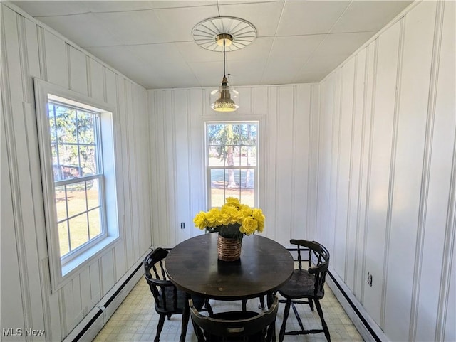 dining space with light floors and a wealth of natural light