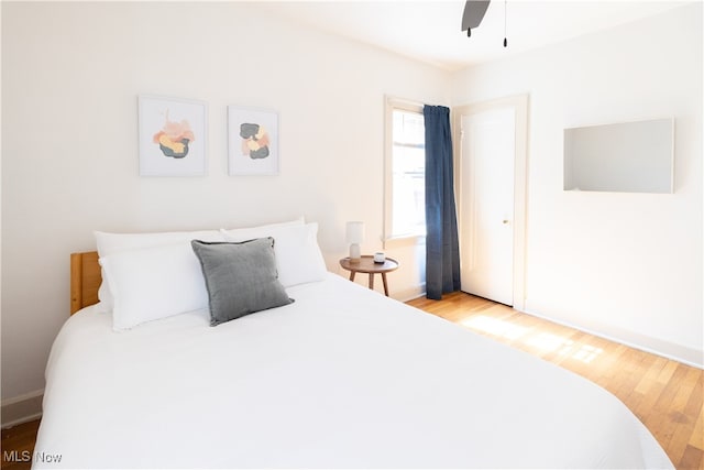 bedroom featuring a ceiling fan and light wood-type flooring