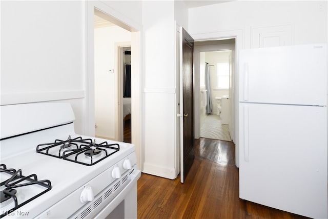 kitchen with dark wood-style floors and white appliances