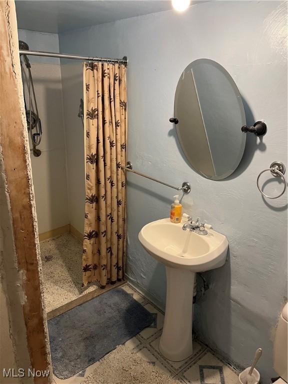 full bathroom with a shower stall