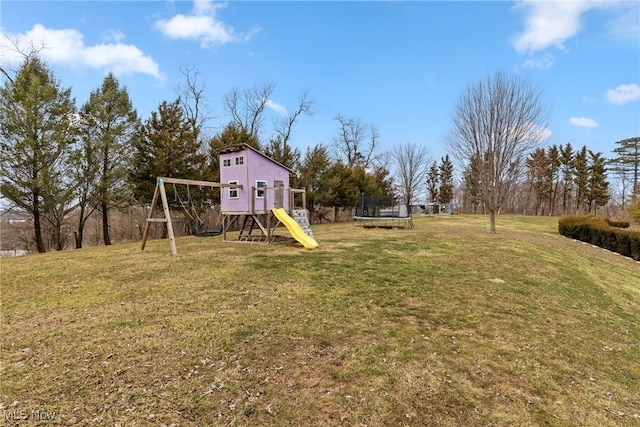 view of yard with a playground and a trampoline