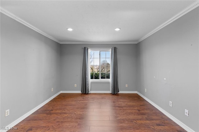 spare room featuring recessed lighting, crown molding, baseboards, and wood finished floors