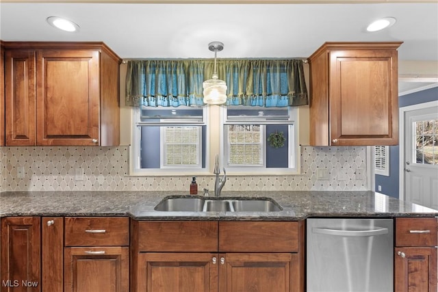 kitchen featuring dark stone countertops, brown cabinetry, a sink, decorative backsplash, and dishwasher