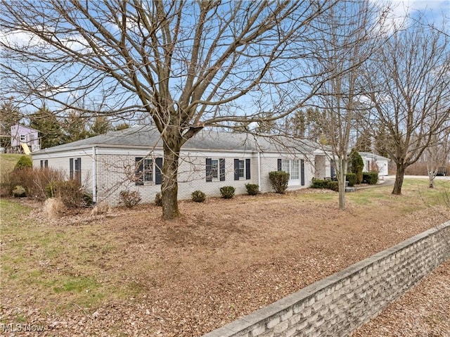 single story home with brick siding