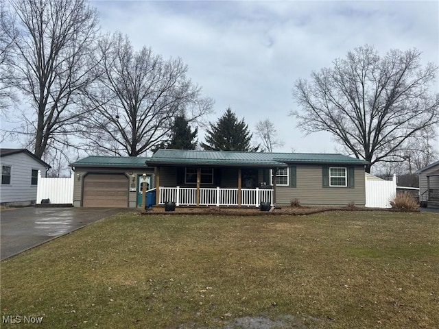 single story home featuring a garage, a porch, driveway, and metal roof