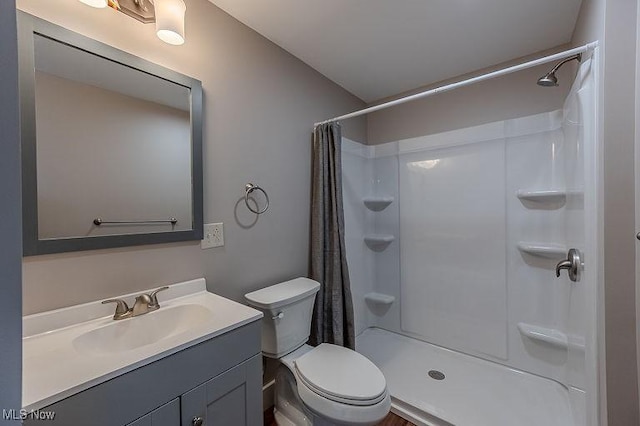 bathroom with vanity, toilet, and a shower with shower curtain