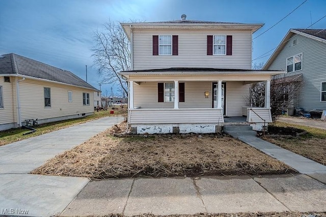 american foursquare style home with covered porch