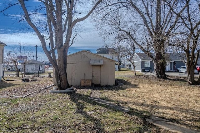 view of yard with an outdoor structure and a storage unit