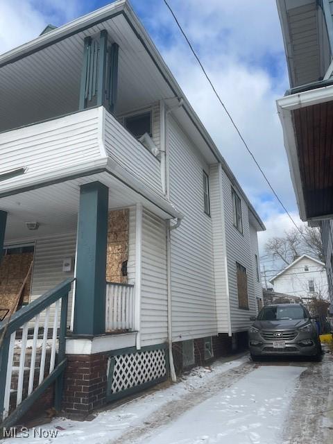 view of side of property featuring a balcony