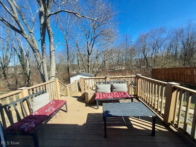 wooden terrace featuring an outdoor living space