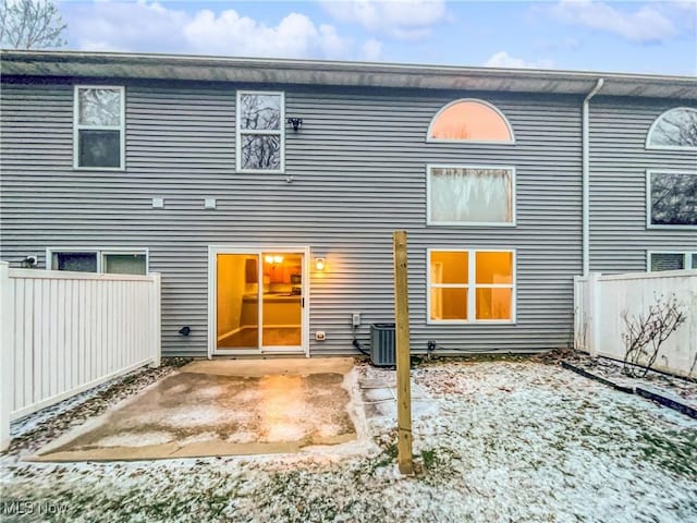 back of property featuring a patio, cooling unit, and fence