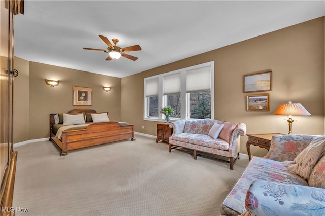 bedroom with baseboards, a ceiling fan, and carpet flooring