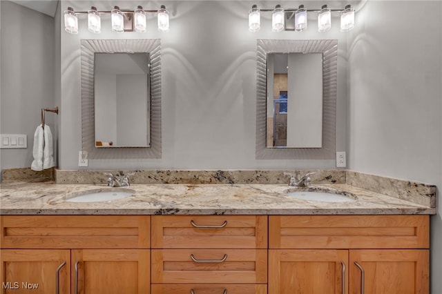 bathroom featuring double vanity and a sink