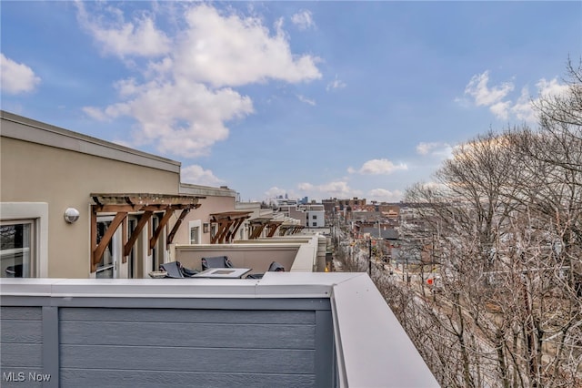 view of patio featuring a balcony