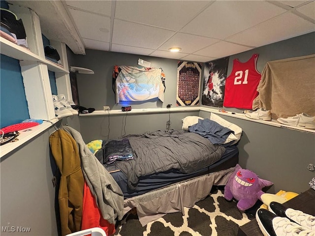 bedroom featuring a paneled ceiling