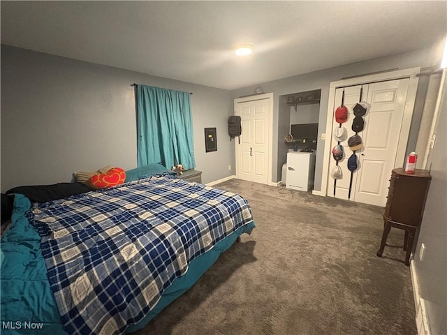 bedroom with baseboards and carpet