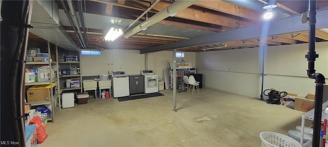 basement with washer and dryer and a healthy amount of sunlight