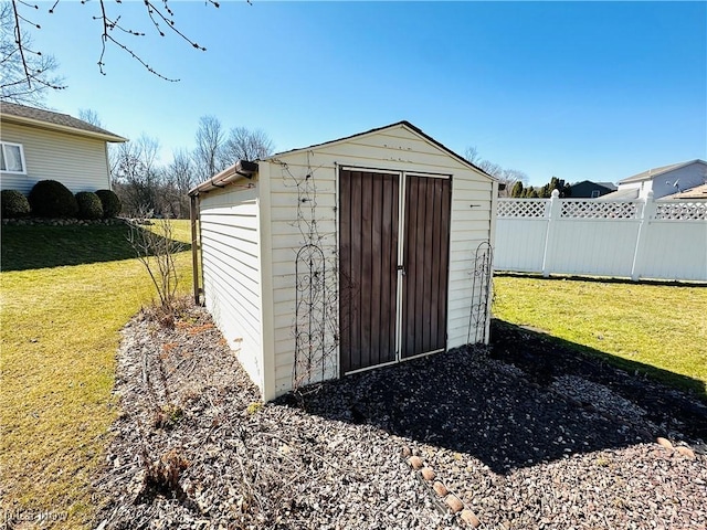 view of shed with fence