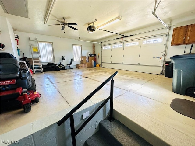 garage featuring ceiling fan and a garage door opener