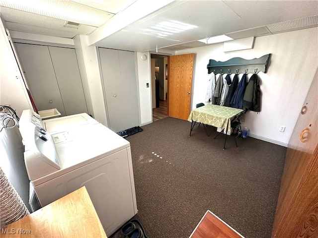 clothes washing area with laundry area, carpet, baseboards, and washing machine and clothes dryer