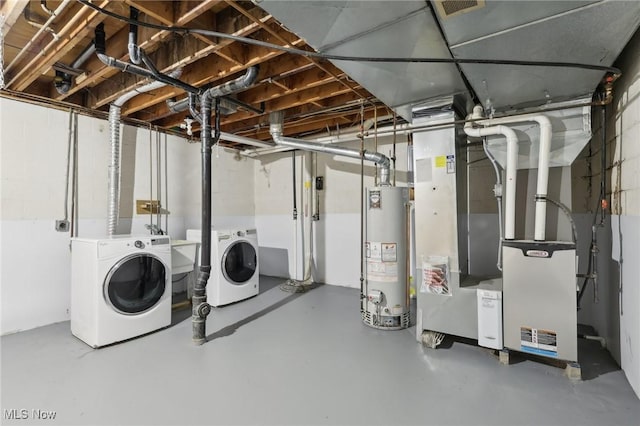 unfinished basement with water heater and washer and clothes dryer