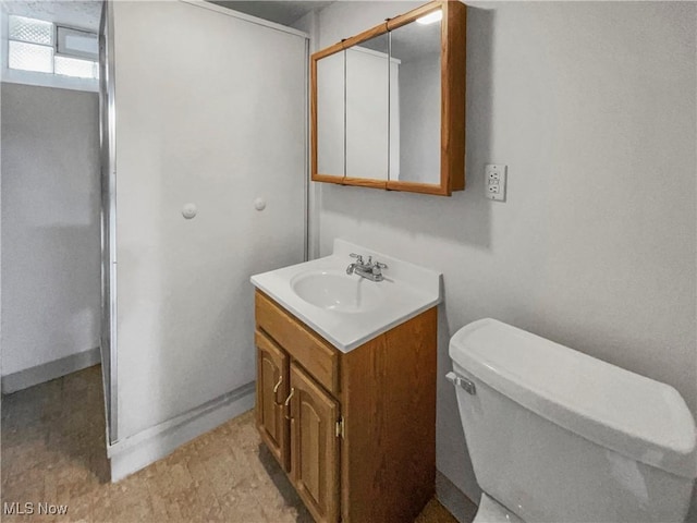 bathroom with toilet and vanity