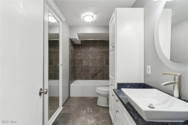 full bathroom with toilet and vanity