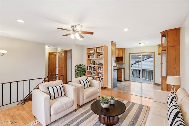 living room with a ceiling fan, recessed lighting, and light wood finished floors