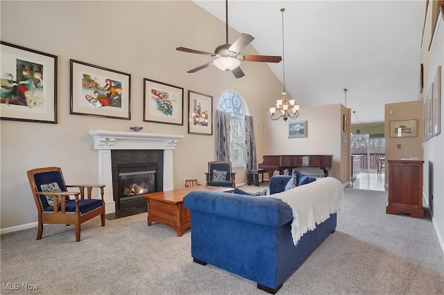 carpeted living area featuring ceiling fan, a fireplace with flush hearth, baseboards, and high vaulted ceiling