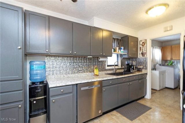 kitchen with a sink, backsplash, washing machine and dryer, dishwasher, and open shelves