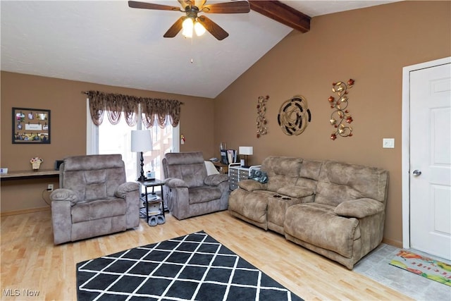 living area featuring baseboards, lofted ceiling with beams, ceiling fan, and wood finished floors