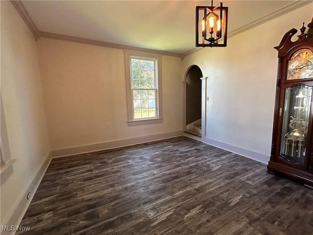 interior space featuring dark wood-style floors, arched walkways, and ornamental molding