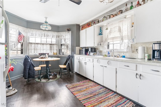 537 Main St, Navarre, OH 44662 - kitchen featuring light countertops, plenty of natural light, and dark wood-style floors