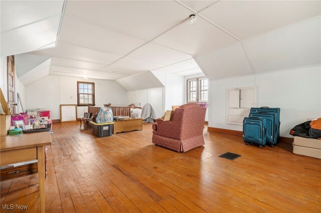 537 Main St, Navarre, OH 44662 - additional living space with lofted ceiling, baseboards, and wood-type flooring