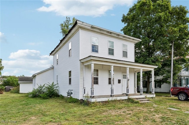 view of front of home featuring a porch and a front lawn