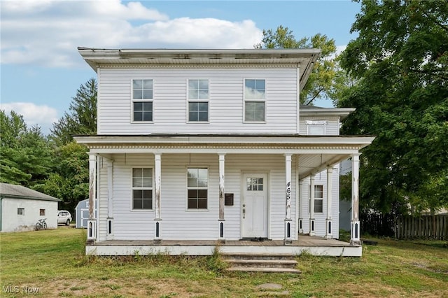 italianate home with a front lawn and covered porch