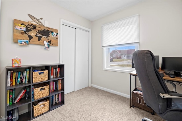 office with baseboards and carpet floors