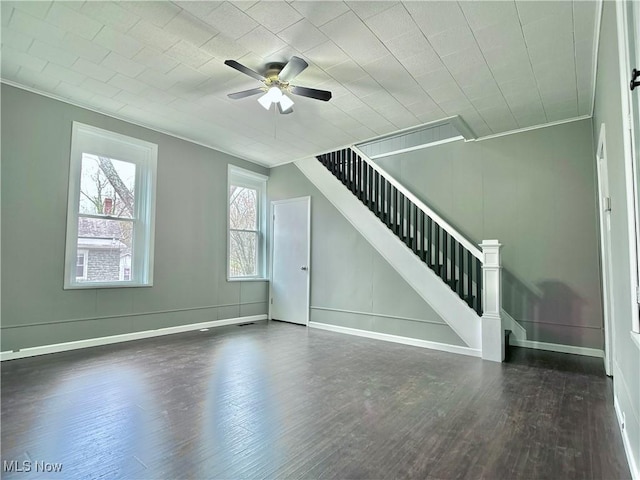 1341 Sharon Ave, Zanesville, OH 43701 - unfurnished living room with crown molding, stairway, baseboards, ceiling fan, and wood finished floors