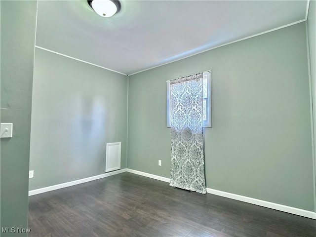 1341 Sharon Ave, Zanesville, OH 43701 - spare room with baseboards and dark wood-style flooring