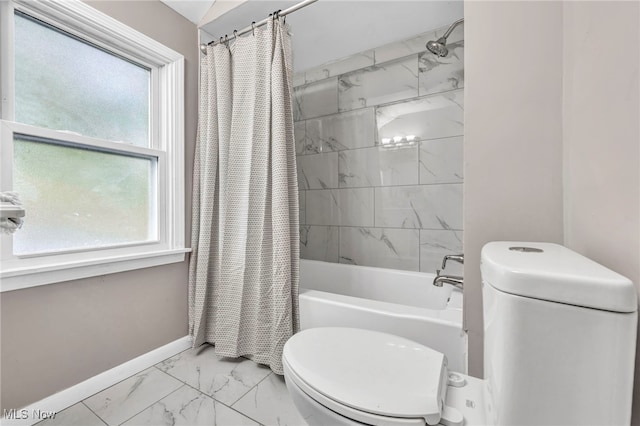 bathroom with marble finish floor, toilet, baseboards, and shower / bath combo