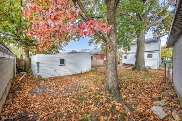 view of yard featuring an outdoor structure and a fenced backyard