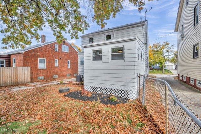 rear view of property with fence